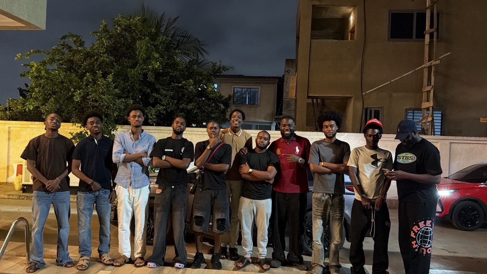 The Bellavino Boyz, the crew behind The Bellavino Experience, lined up together at night